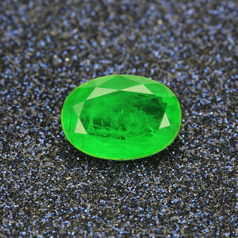 

Oval shape natural crystal add glass green color and red color loose stone
