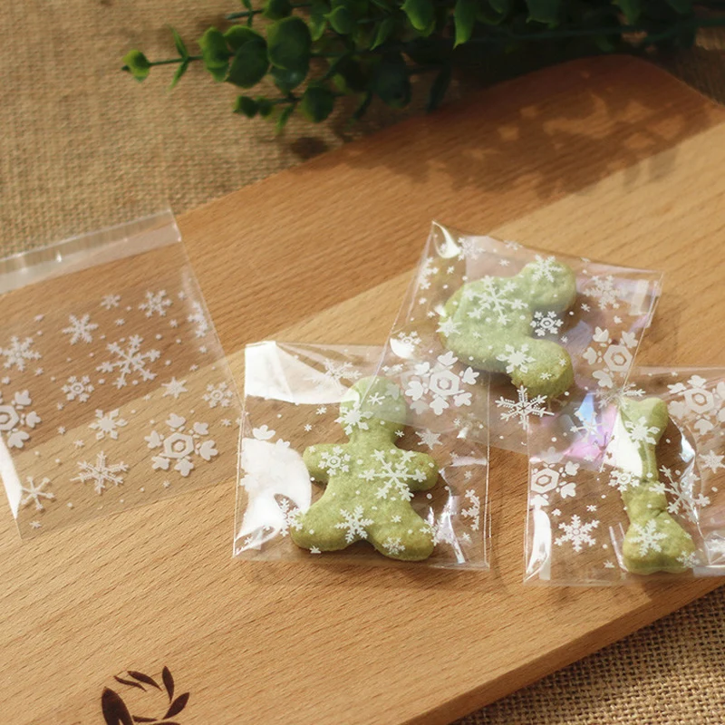 

WHISM 100pcs Self-Adhesive Cellophane Bag Candy Box With Snowflake Xmas Dessert Cookie Bags Wedding Christmas Gift Decorations