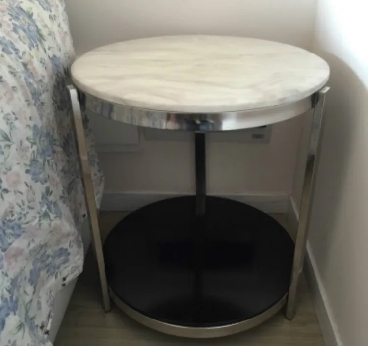 Small round tea table marble. Stainless steel. The sofa side table.