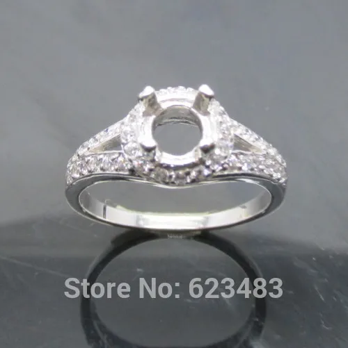 

SOLID 14kt WHITE GOLD 4MM ROUND CUT 0.29CT . SEMI MOUNT ENGAGEMENT RING