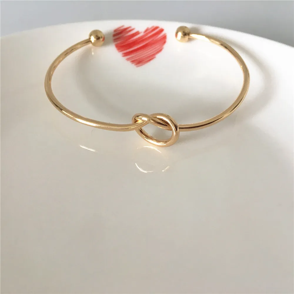 

TRENDY GOLD COLOR PLATING KNOT PATTERN WITH BALL END BANGLE FOR WOMEN