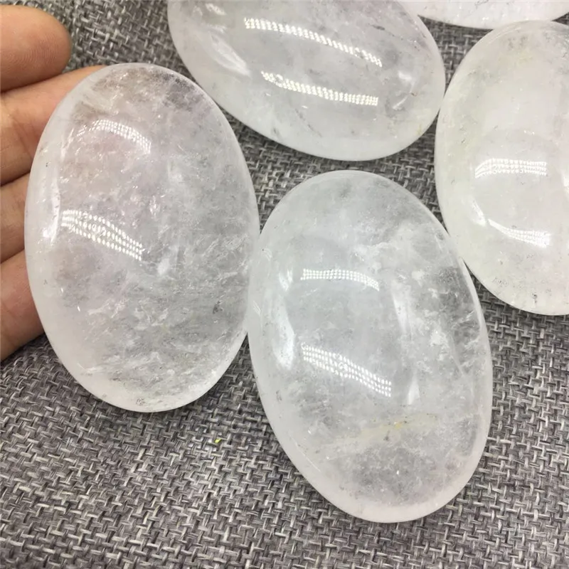 

natural polished clear white quartz crystal palm worry stone for sale
