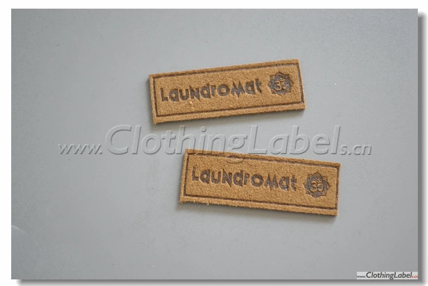 custom suede leather label with embossed logo, brown color, microfibre