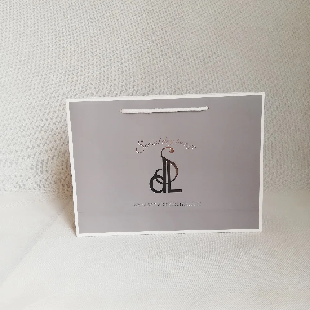 

Wholesale 500PCS/Lot High quality Customized logo paper shopping bag with rope handle/cloth/jewelry customized advertising bag