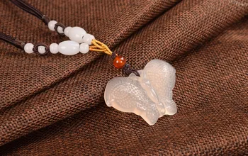 

100% genuine, natural white jade chalcedony butterfly pendant.