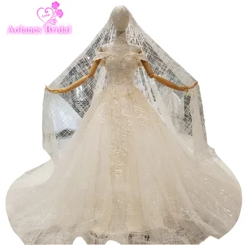 

2018 Champagne Lace Sleeveless Chapel Train Bridal Gowns Ball Gown Backless Wedding Dresses With Long Crystals Veil Real Photos