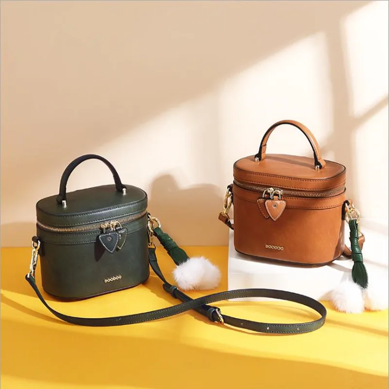

2018 new solid color single shoulder portable diagonal large capacity PU bag simple wild small round bag bucket bag