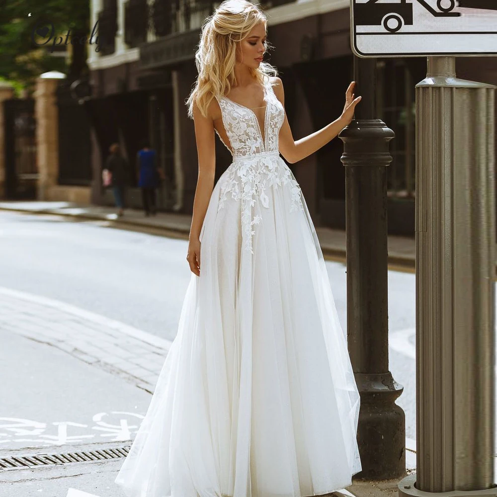 

Optcely Sexy Sleeveless White Deep V-neck Beach Wedding Dresses 2019 Elegant Appliques Bridal Gowns Customized Vestido de Noivas