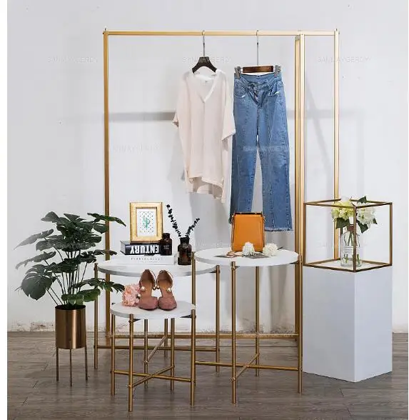 Clothing store combination booth high and low water table display creative island decoration high-end shop window decorations.