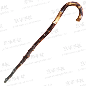 

a Rattan cane natural bent wooden cane crutch