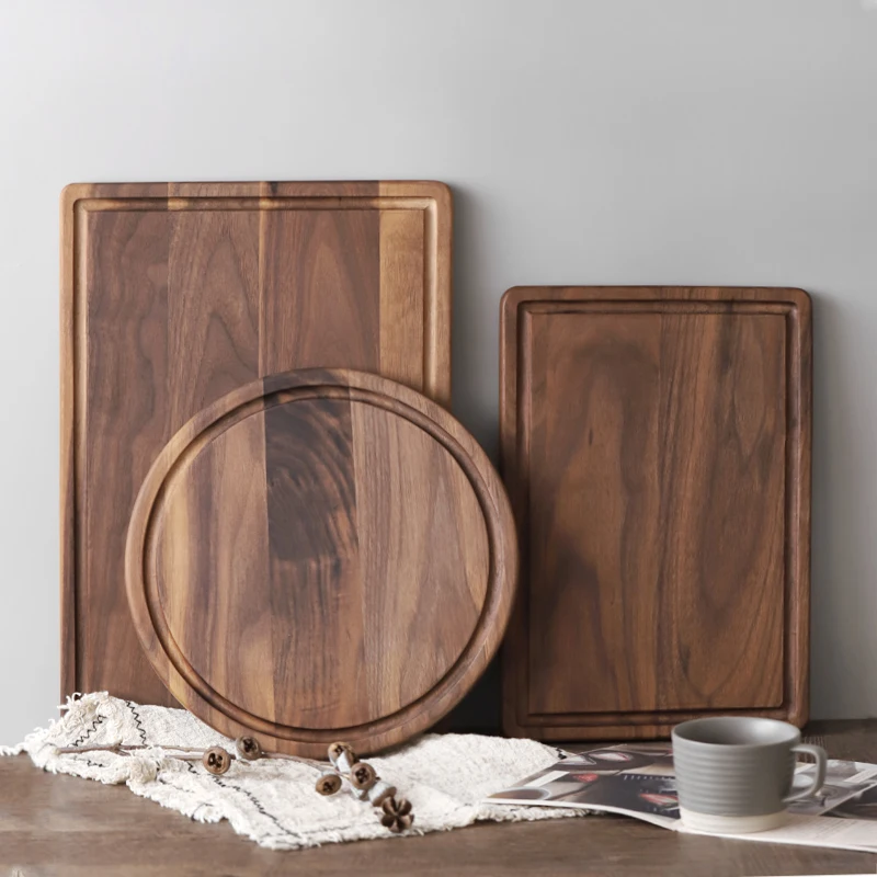 

Black walnut round pizza chopping board Solid wood unpainted household cutting board Slotted steak plate bread