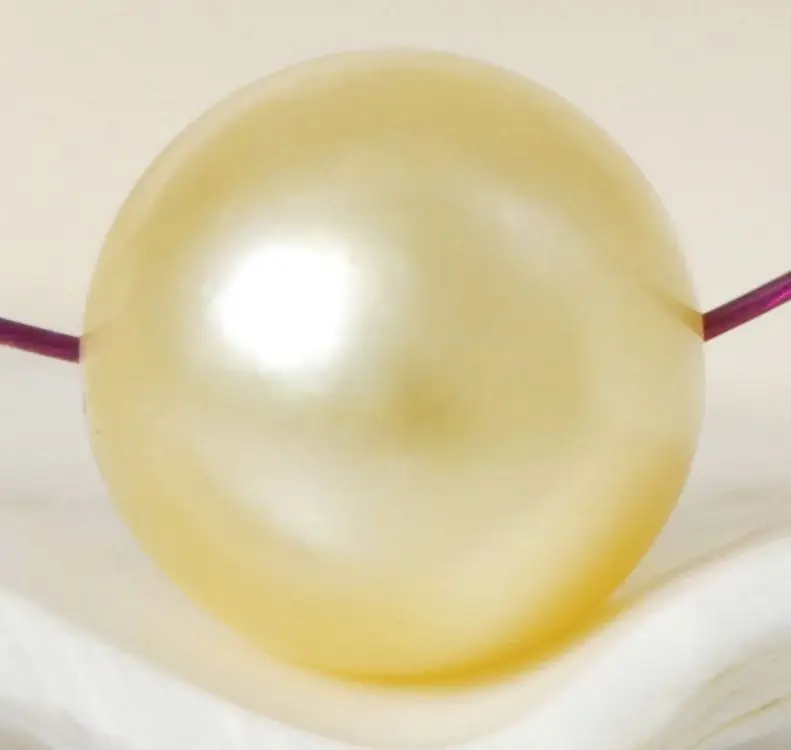 

10-11mm natural south seas gold loose pearl fully drilled
