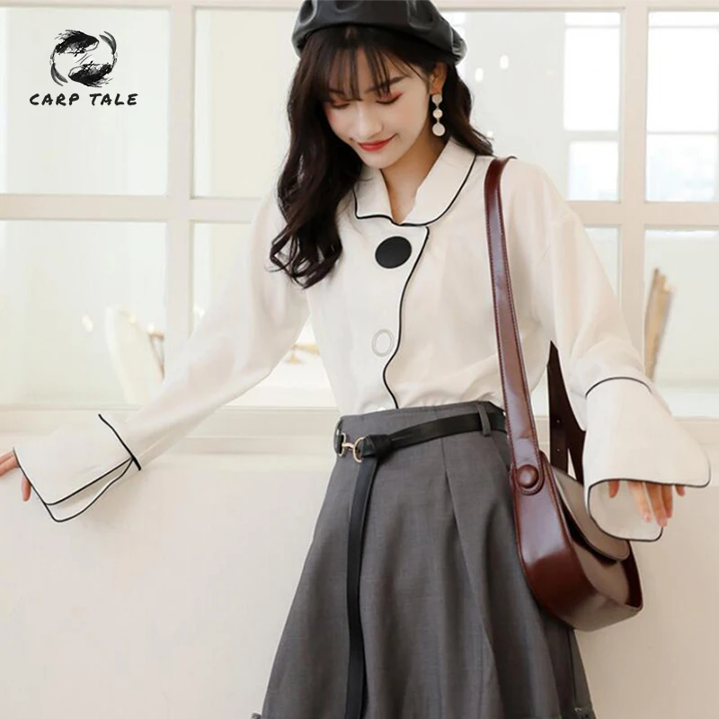 

2019 spring and summer Korean version of the new black edge hit color wild niche shirt French temperament white shirt female