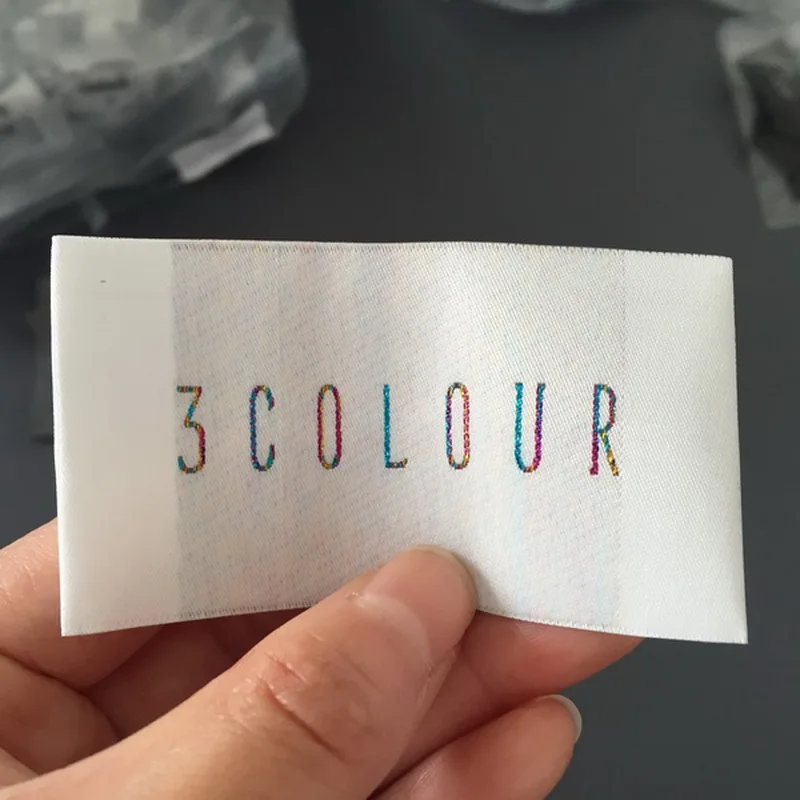 

Custom High Density Metalic Material Letters Woven Labels Clothing Main Label