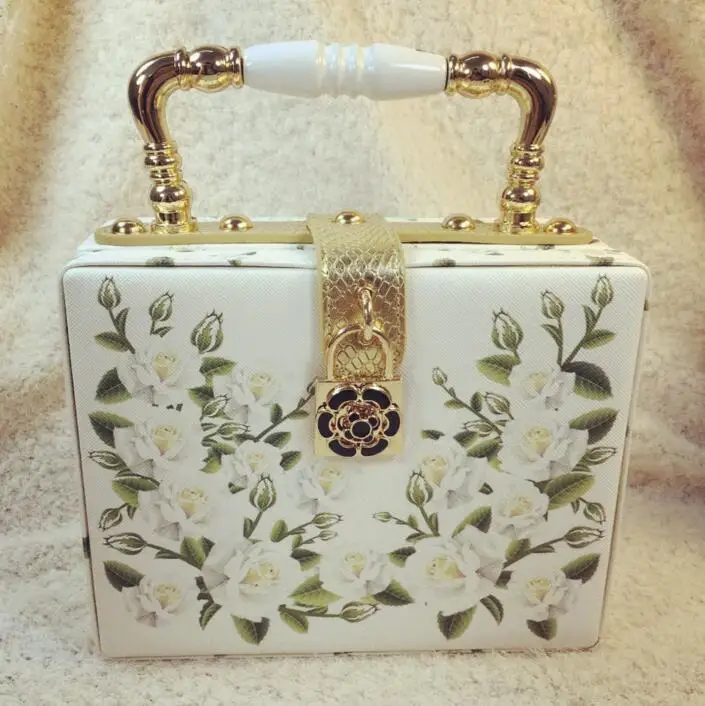 

Free shipping New fashion trend of ceramic metal flower printing Diagonal handbag woman