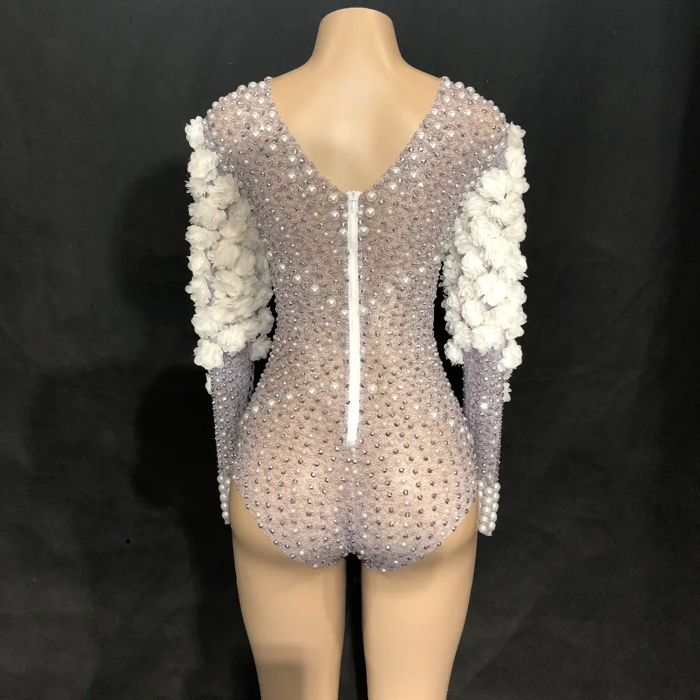 white jumpsuit with rhinestones