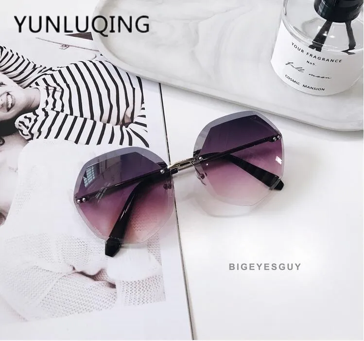 

2018 new circular sunglasses femaleframeless cut edge fashion quality anti UV Sunglasses 54114