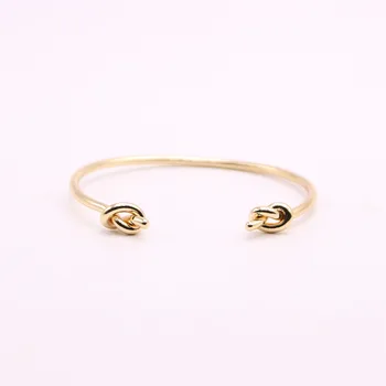 

Metal material bangles for girls Double cross knot women bangles and