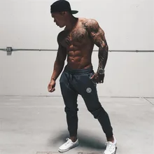 Весенняя мода Мужская джоггеры карандаш гарем Штаны спортивных тренажерные залы одежда Бодибилдинг моды фитнес пот Штаны