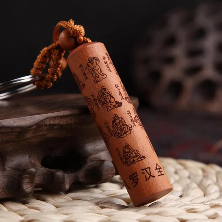 

Chinese Peach Wood Carved Cylinder Pendant Eighteen Arhats Scripture Word Exquisite Car Key Chain Pendant