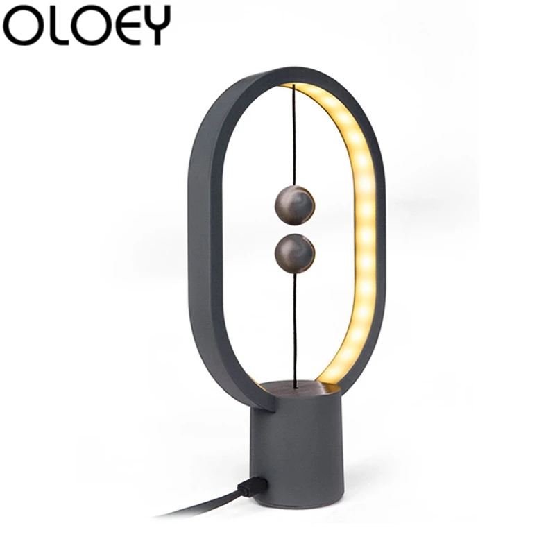 Najtaniej Europejska kreatywna lampa stołowa magnetyczna owalna lampa stołowa indukcyjna salon dekoracja sypialni nowość