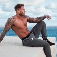 Новинка, мужские хлопковые спортивные штаны, повседневные Модные обтягивающие штаны, мужские спортивные штаны для фитнеса, бодибилдинга, Мужские штаны для бега, Брендовые брюки-карандаш