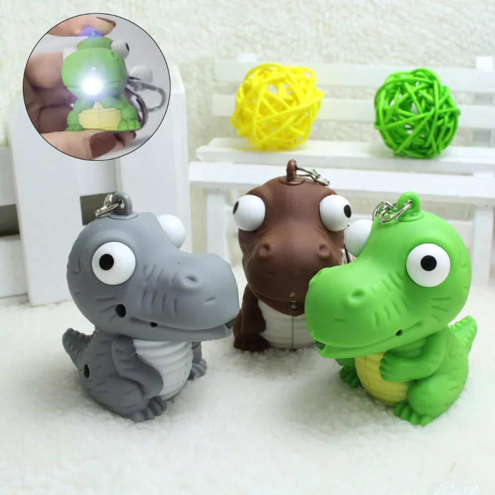 

Funny Cartoon Blinking Dinosaur LED Keychain Animel Keyholder Mini PVC Action Figure LED Light & Sound Dragon Keyring Pendant