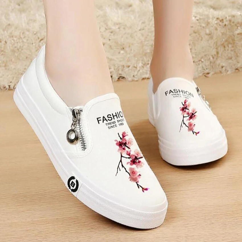 white canvas slip on sneakers