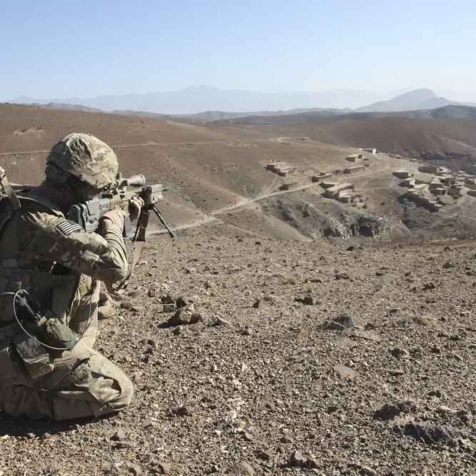 U.S. Army soldier provides security for infantry patrolling through Dandarh village  Afghanistan Poster Print (34 x 23)