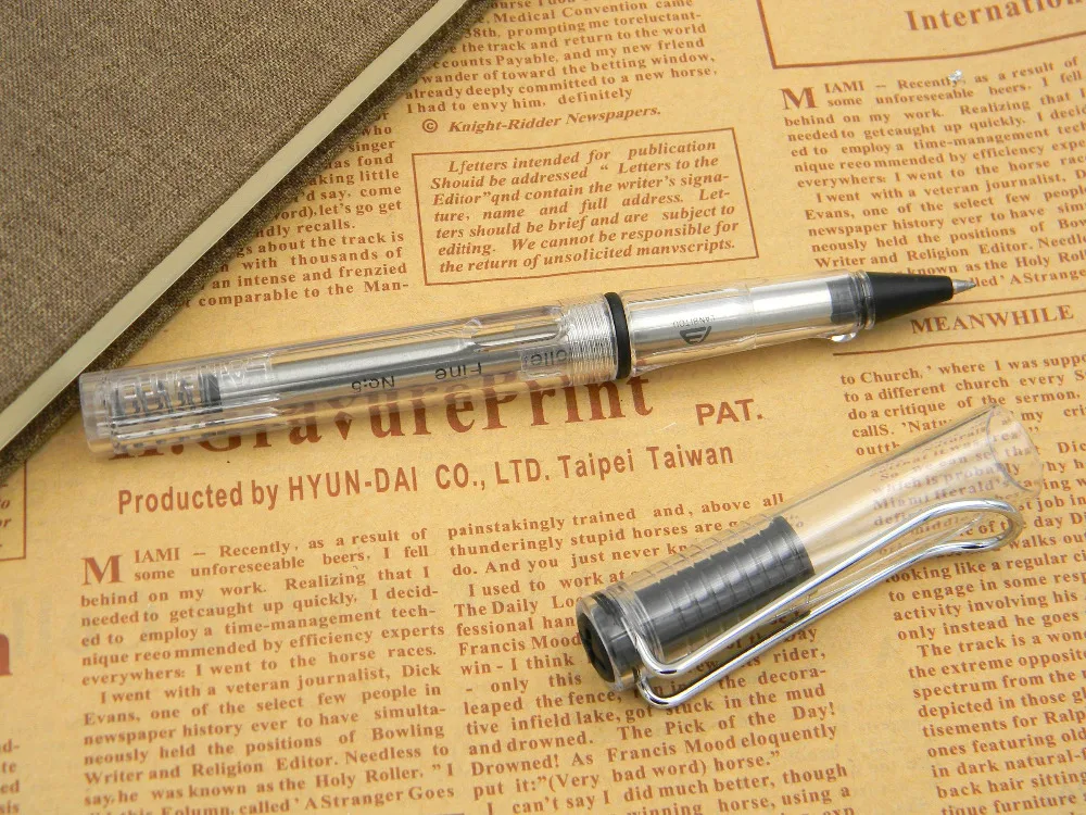Подарок прозрачный пластик гладкий с серебряной отделкой роллербол ручка
