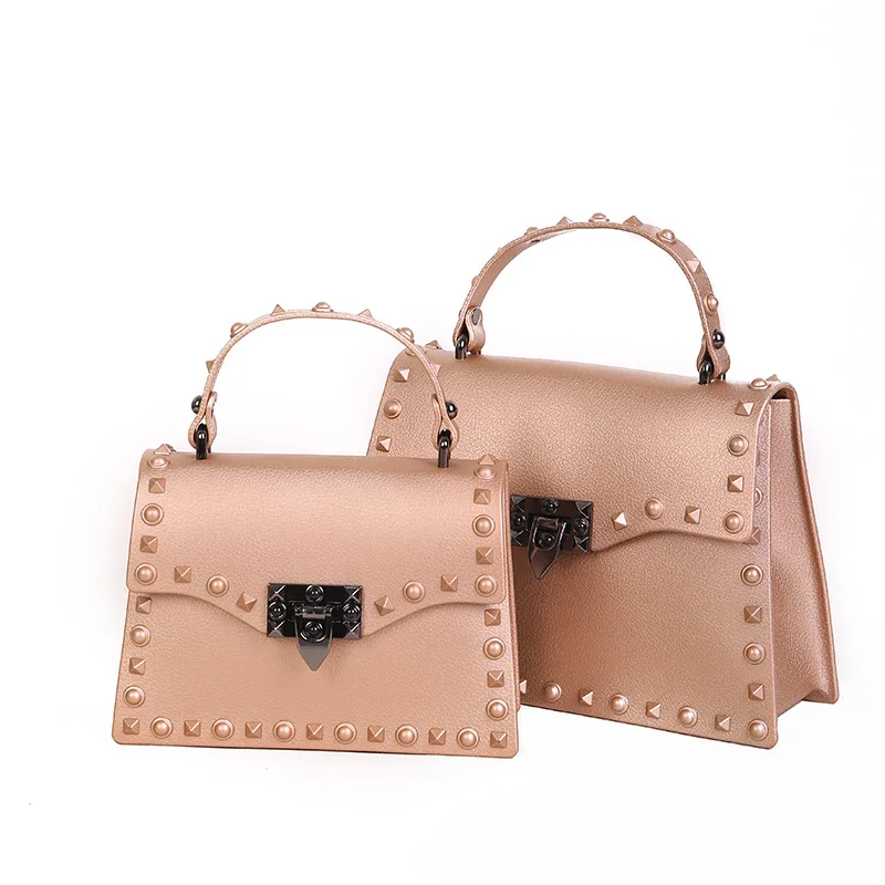 

2018 new PVC matte frosted jelly bag rivets laptop shoulder bag female Messenger bag.