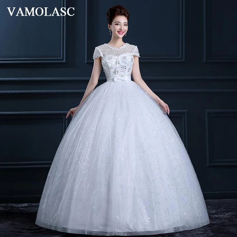 VAMOLASC Illusion Sequined O Neck Ball Gown Lace Wedding Dresses Short Cap Sleeve Bow Sash Backless Bridal Gowns