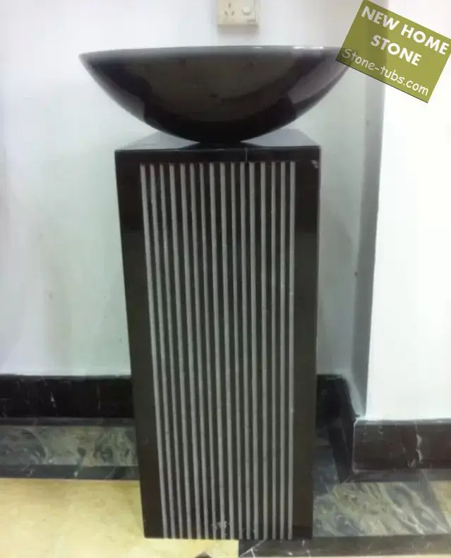 black toilet and pedestal sink
