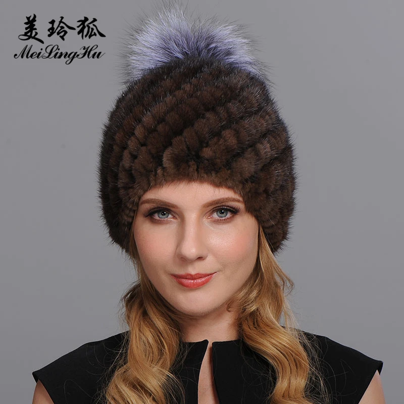 hat with fur ball on top