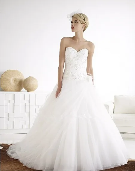 

tulle ball gown soft handmade rosette Bodice features lace Swarovski crystals beading zipper closure wedding dress bridal gown