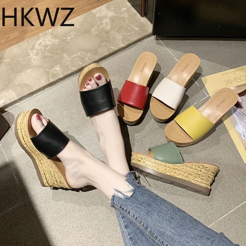

Outside wearing wedges slippers women's new simple solid color cakes thick bottom one word tow beach shallow mouth women's shoes
