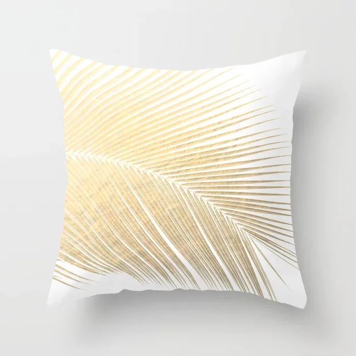 palm-leaf-gold-pillows.webp