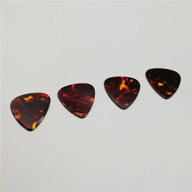 Free Shipping 100PCS Tortoise Shell Color Celluloid Guitar Picks Different Thickness Guitar Plectrum Free Shipping 100PCS Tortoise Shell Color Celluloid Guitar Picks Different Thickness Guitar Plectrum