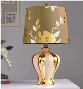 

Ceramic lamp. Bedroom bedside lamp. Gold Chinese lamp