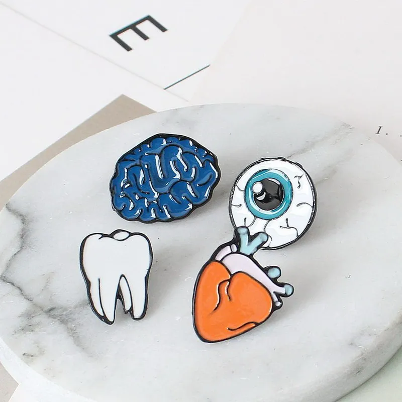 

Korean version of the jewelry color drops of human body brooches brain eyes tooth brooch accessories wholesale Pin Badge