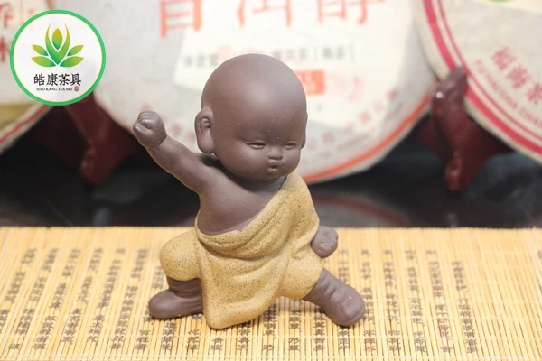 

Kung fu tea set tea pet A young monk in a battle stance (yellow clothes) tea figure