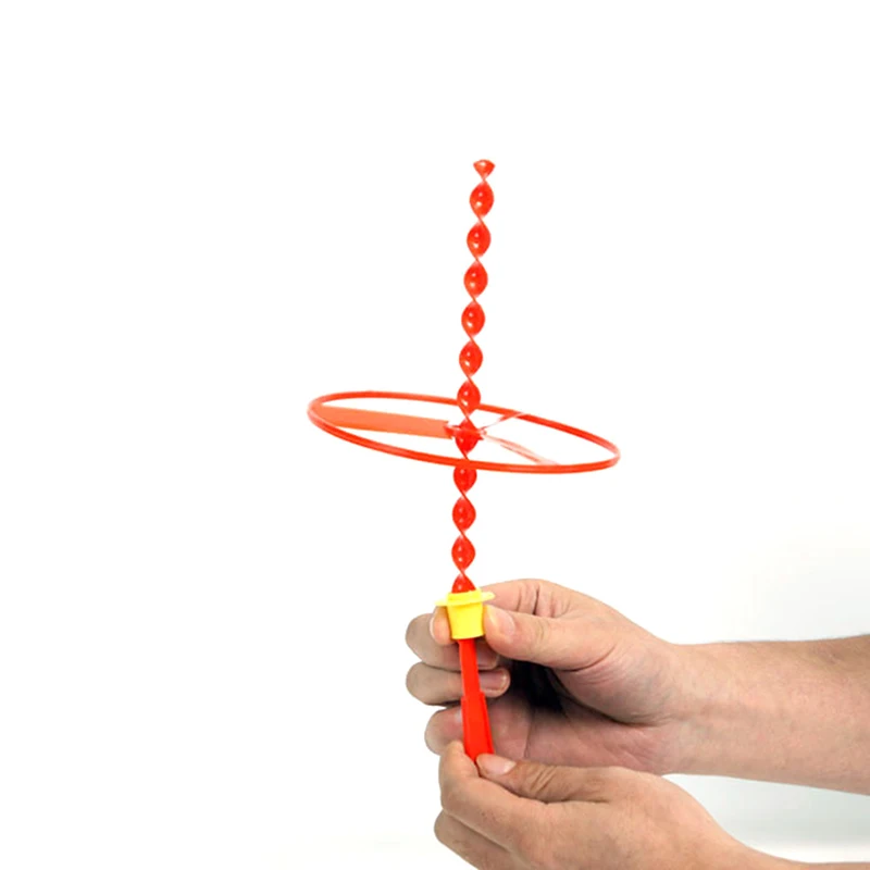 Игрушка которая крутится на. Spin drop up игрушка. Пластиковая спираль. Игрушка вращающийся мяч. Вращающиеся игрушки.