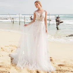 Eightree Beach Wedding Dress Fashion Design Appliques A-line Dress Bridal 2019 Illusion O Neck Cap Sleeve Bride Gown Back Button Eightree Beach Wedding Dress Fashion Design Appliques A-line Dress Bridal 2019 Illusion O Neck Cap Sleeve Bride Gown Back Button