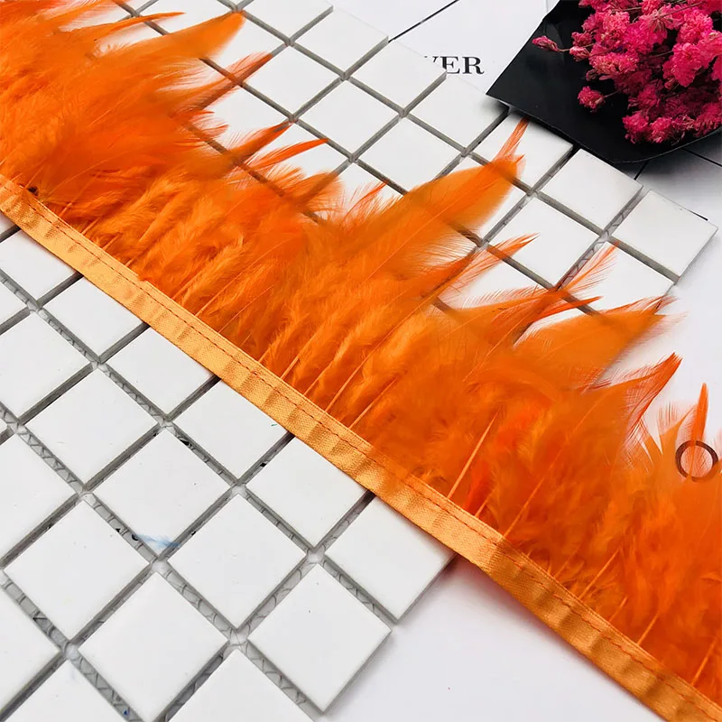 

Wholesale Price in Factory 10 yard Good Quality Dyed ORANGE Rooster Neck Hackle Feathers Trimming