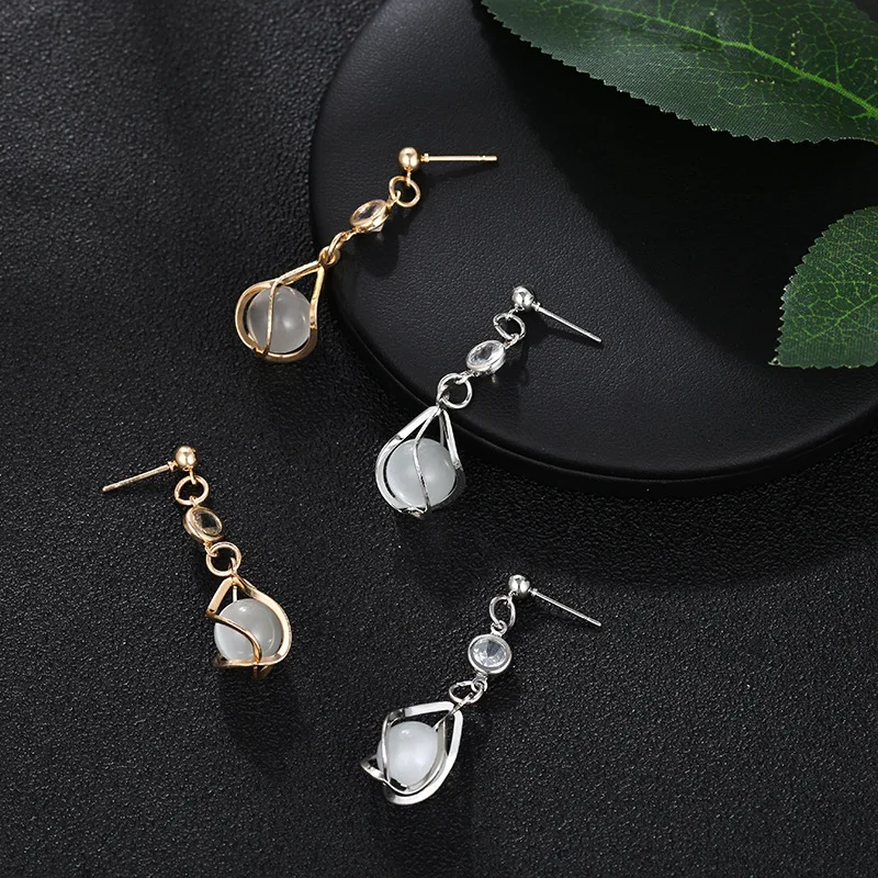 Korean version of the temperament popular earrings long diamonds hollow cats eye cute sweet simple wind delicate earrings