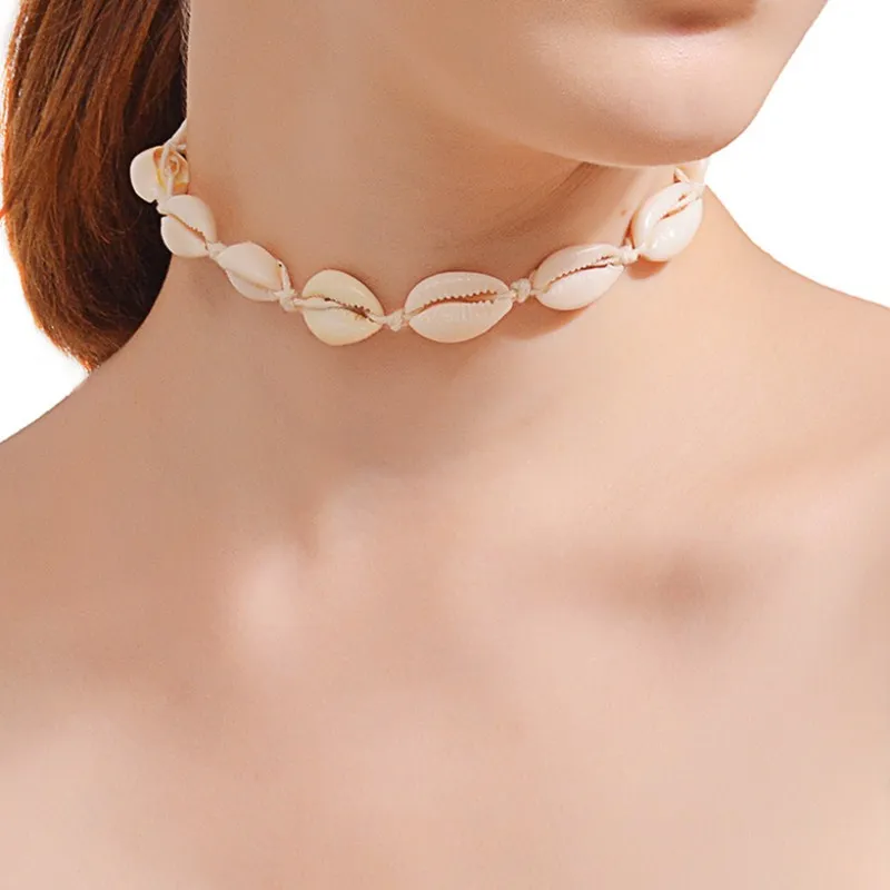 NK142 بوهيميا بوهو البحر Cowrie شل المختنق قلادة النساء حبل الطبيعي شل مجوهرات الشاطئ Chocker بسيطة Neckless للفتيات NK142 بوهيميا بوهو البحر Cowrie شل المختنق قلادة النساء حبل الطبيعي شل مجوهرات الشاطئ Chocker بسيطة Neckless للفتيات
