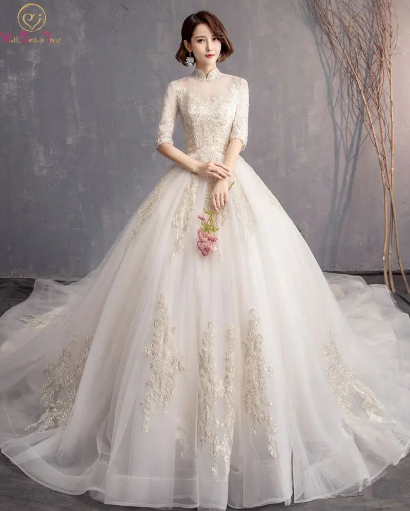 

Stunning Champagne Wedding Dress Elegant High Neck Ball Gown Appliques Three Quarter Sleeves Simple Lace Up Organza Bridal Gowns