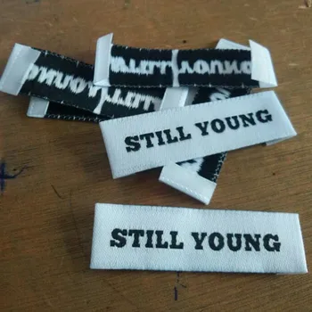 

Custom private name White polyester cloth woven label End fold 55 mm * 15 mm