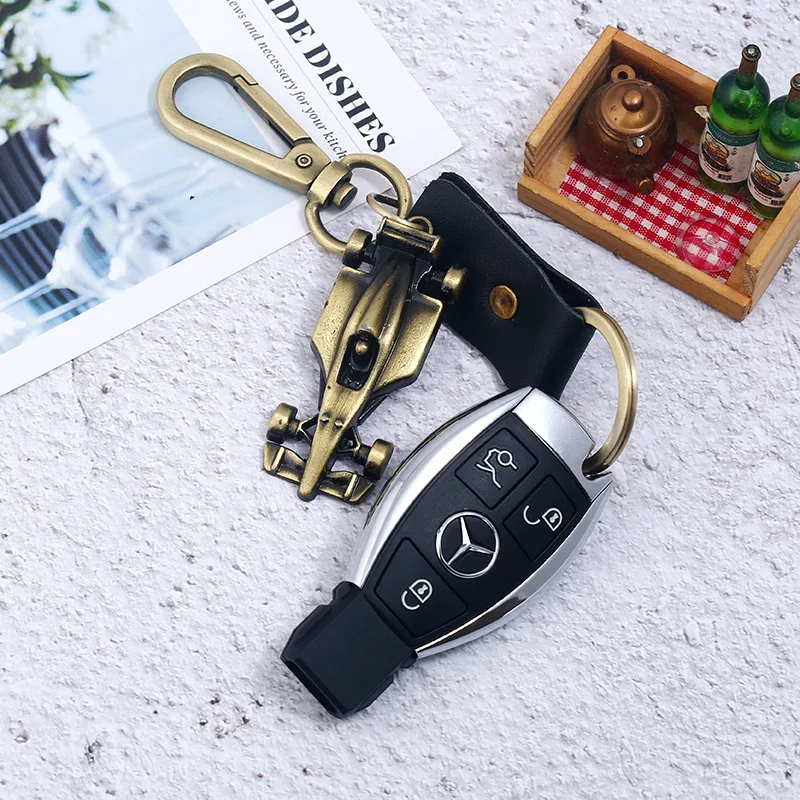 

New Punk Creative Key Holder Organizer Smart Key Wallet Keychain Pocket Rings Gold Color Car Model Genuine Leather Keychains