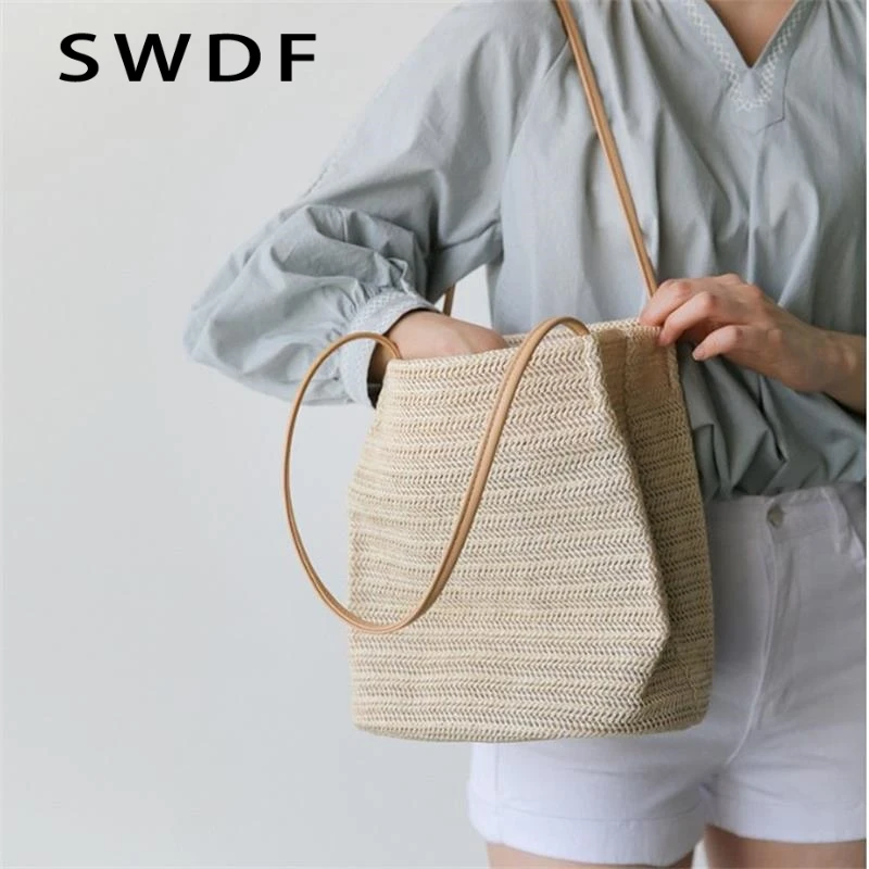 

Best Selling Summer Beige Casual Woven Shoulders Exquisite Straw Bag Ins Wild Bucket Bag Portable Female Messenger Bucket Bag